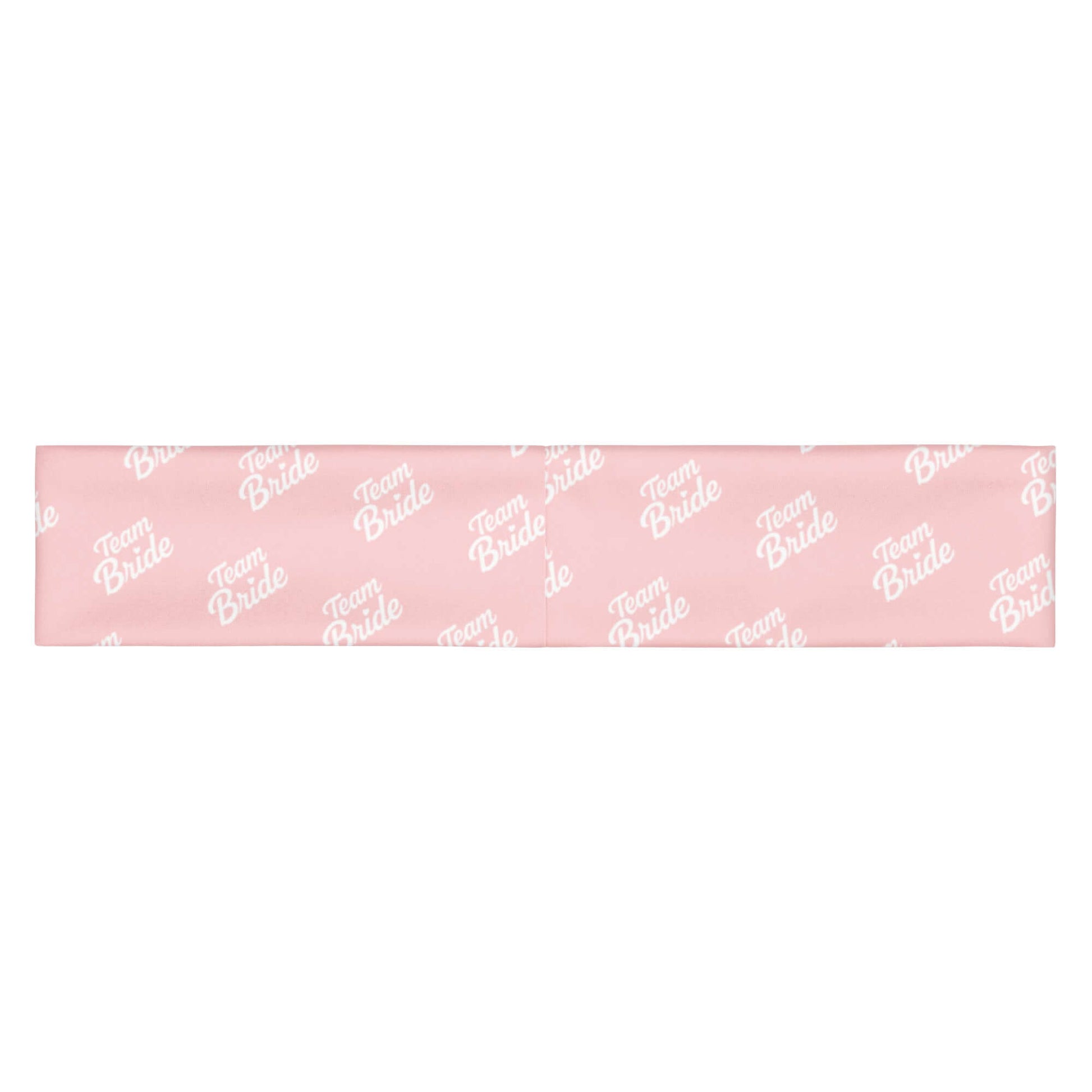 Fascia per capelli rosa "Team Bride" con scritta bianca, perfetta per eventi e momenti di bellezza.