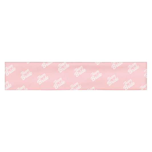 Fascia per capelli rosa con scritta bianca 'Team Bride' per eventi speciali e bridal kit.
