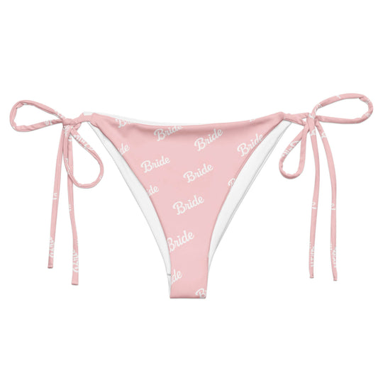 Slip bikini rosa con scritta "Bride", design ecosostenibile con lacci per momenti speciali.