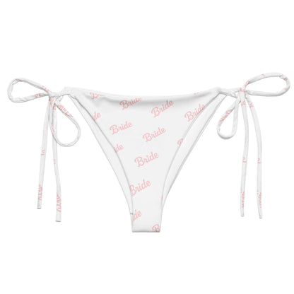 Slip bikini bianco con scritta rosa "Bride" e lacci, perfetto per momenti speciali e addii al nubilato.
