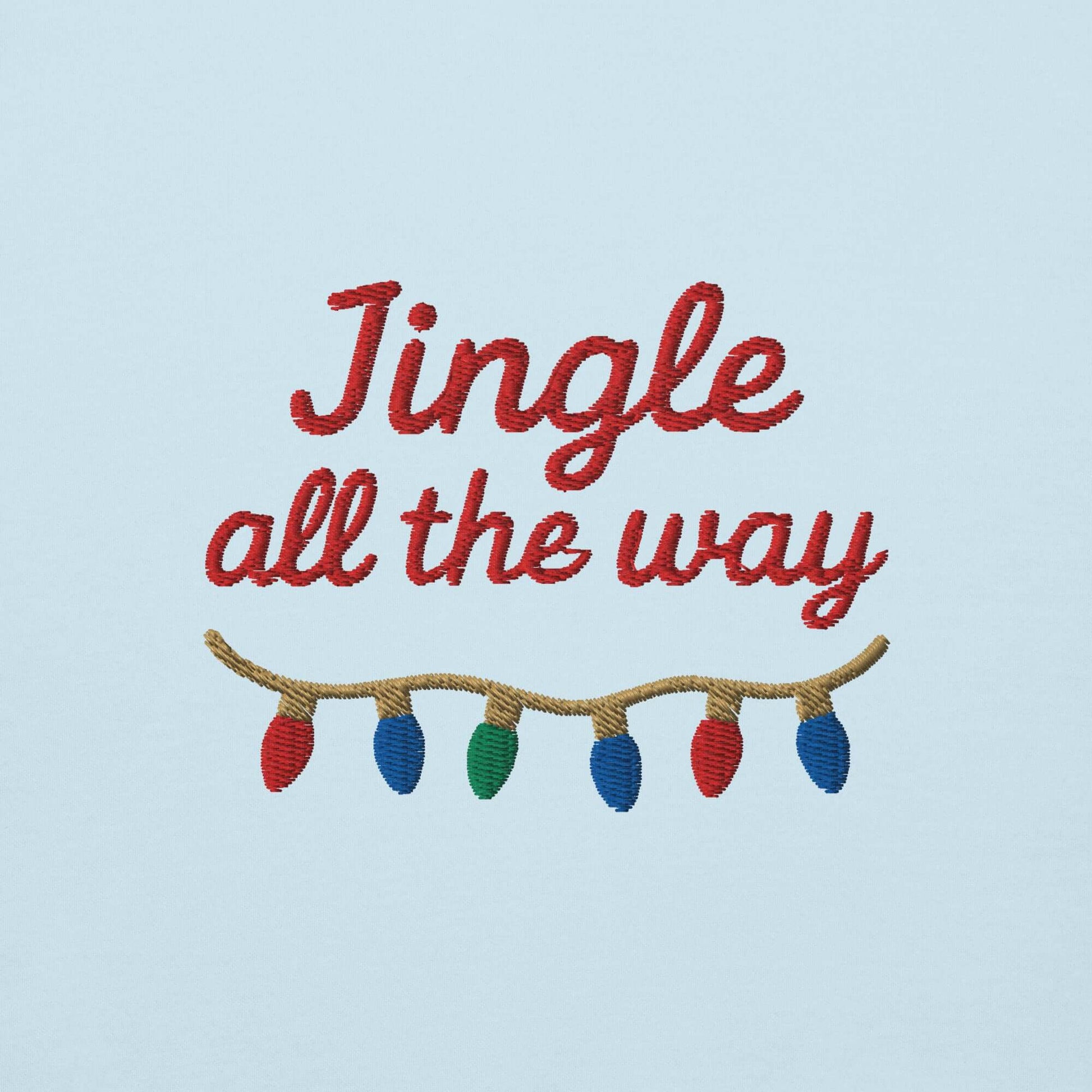 Felpa natale ricamata "Jingle all the way" con ricamo colorato su sfondo azzurro.