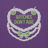 Ricamo felpa compleanno 'Witches don't age' su sfondo viola, design divertente e dark.