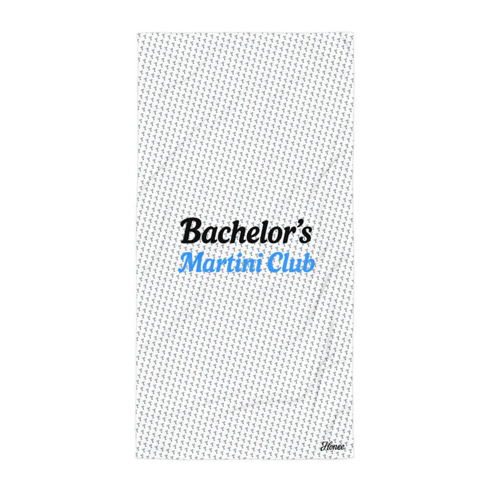 Telo mare addio al celibato con pattern coppe Martini e scritta 'Bachelor’s Martini Club' in bianco e blu.